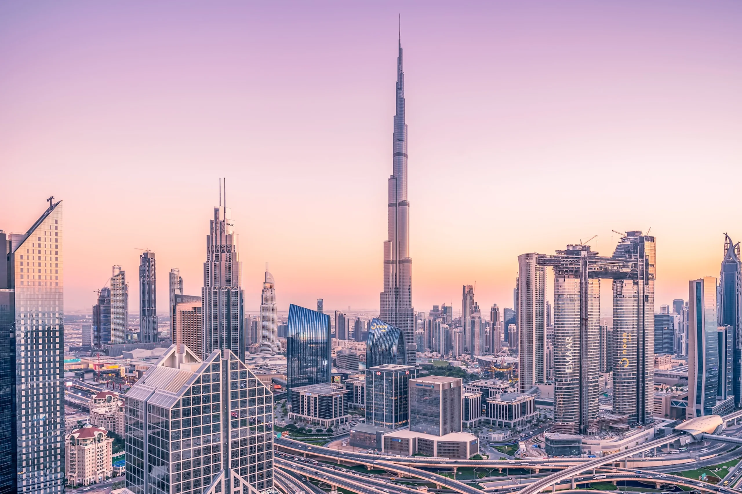 Futuristic city landscape of Dubai with high rise glassy buildings