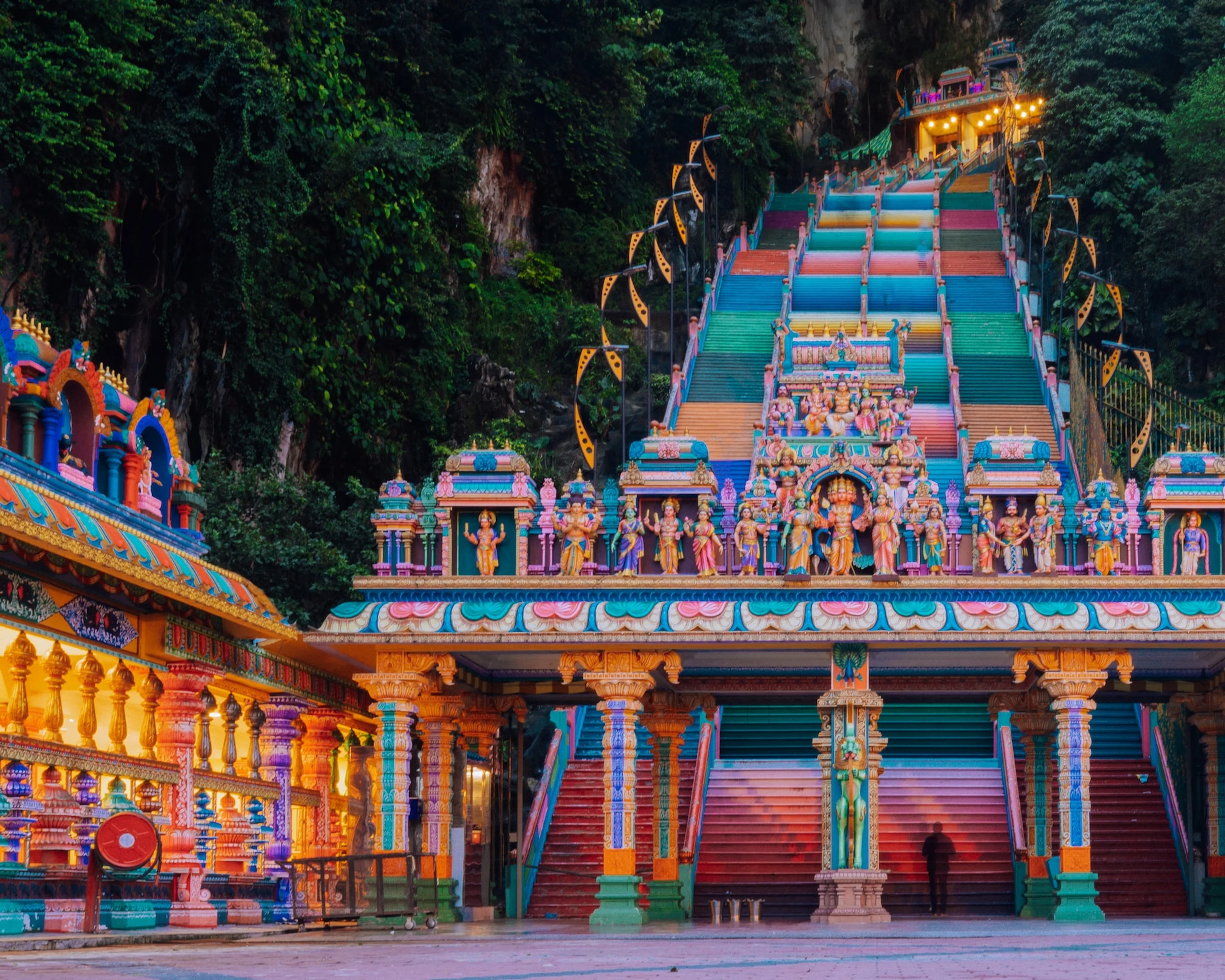 Colourful building of Batu Caves with multicolour steps leading up the mountain