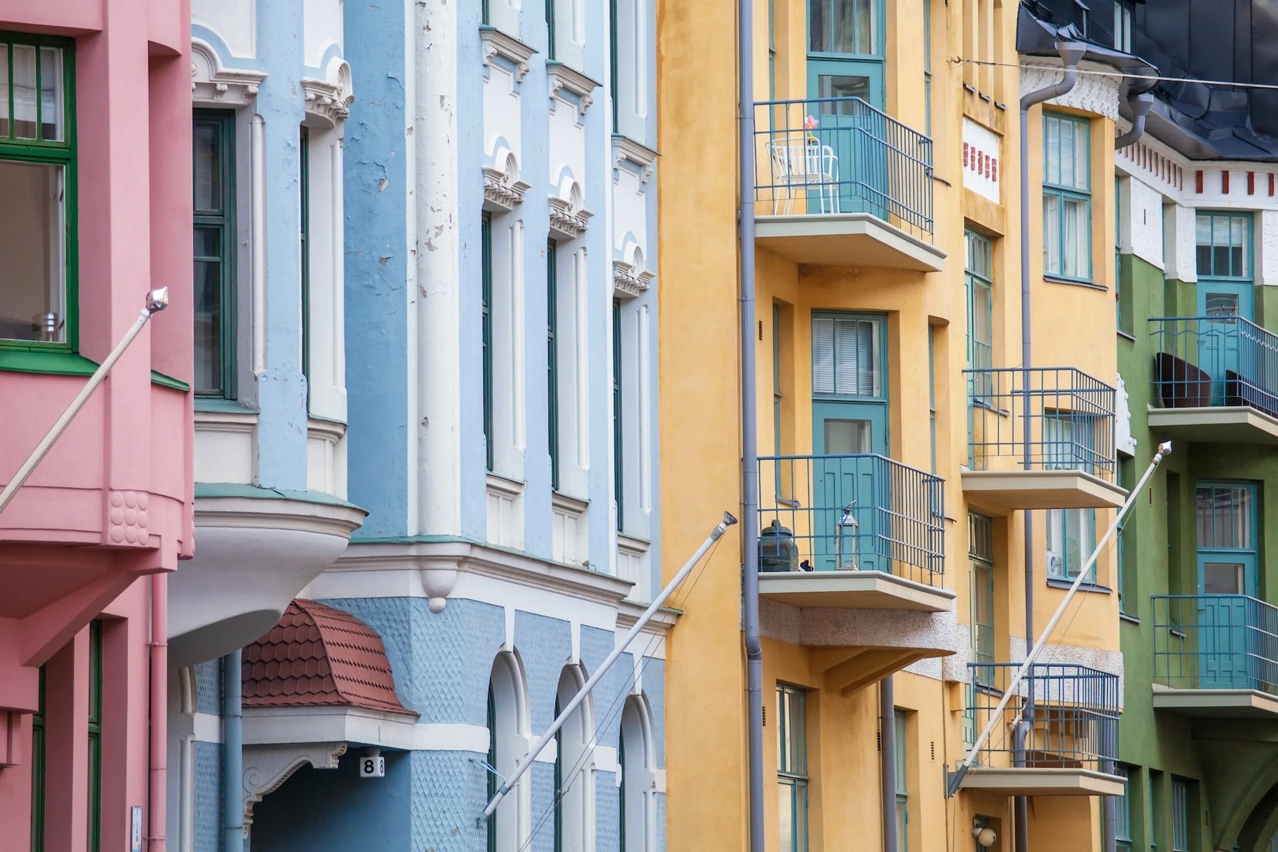 Pink blue yellow and green terraced houses
