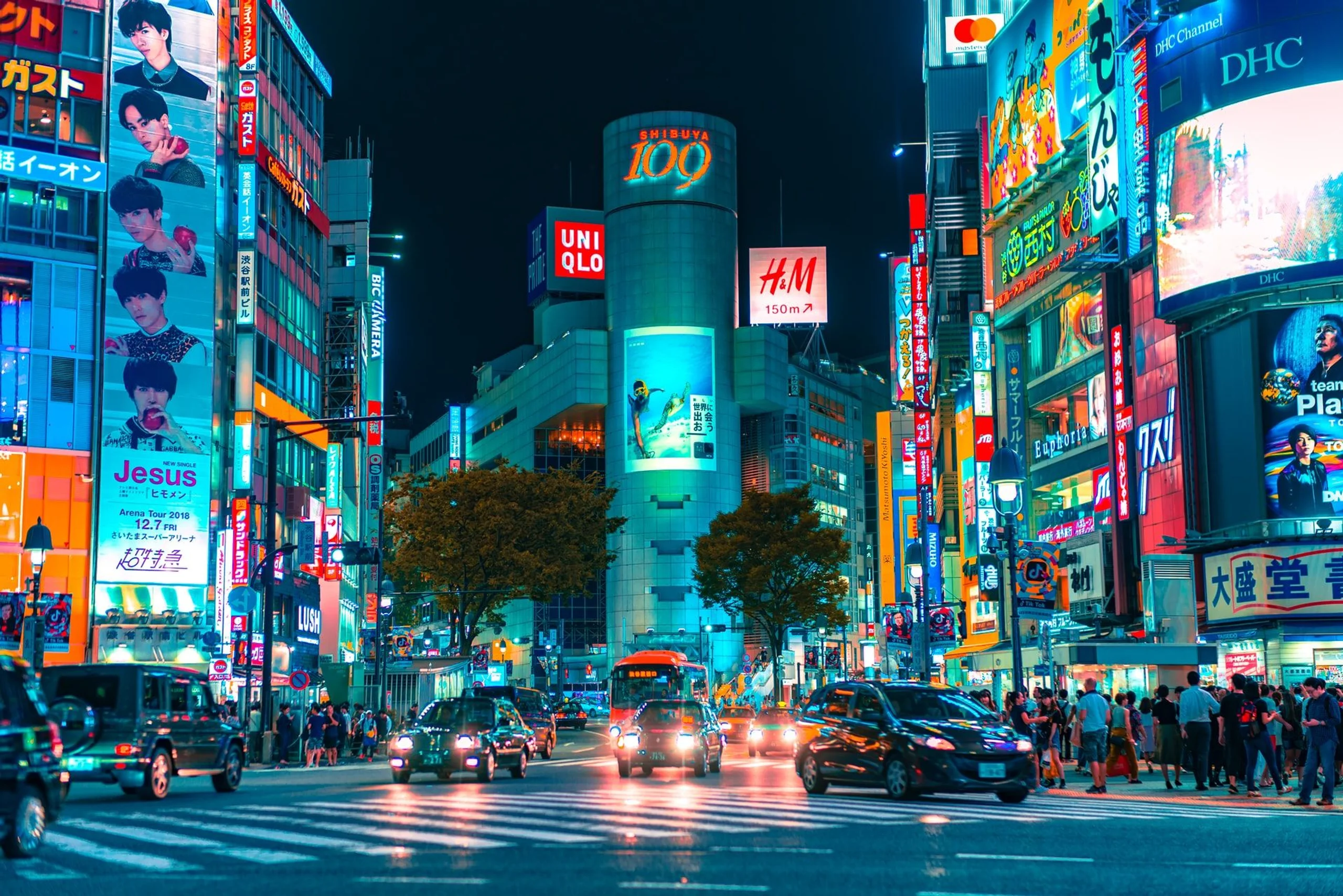 Busy bright lights of an intersection and shopping malls in Shibuya Tokyo Japan
