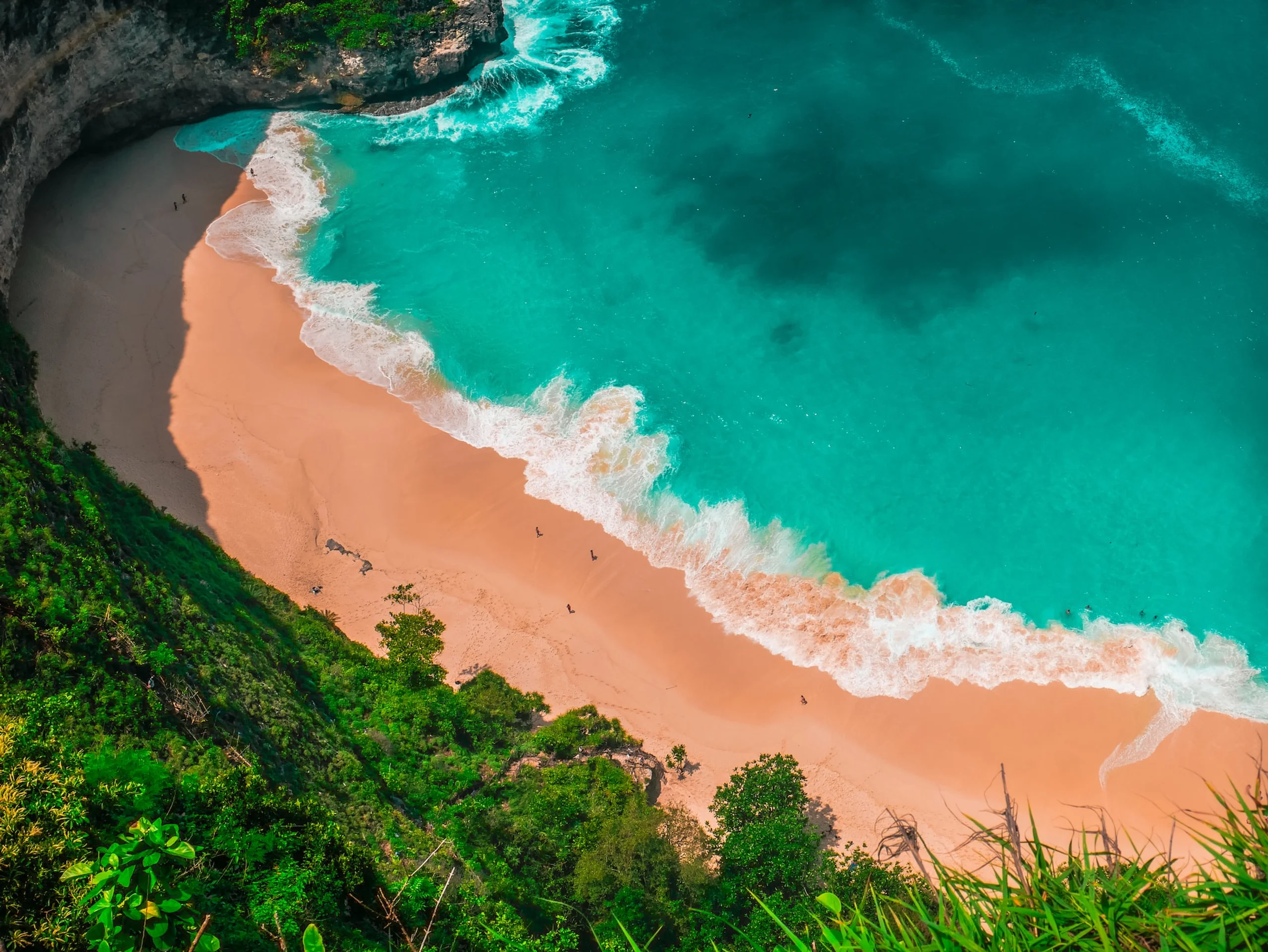 Aerial view of barren beach and crystal blue water 