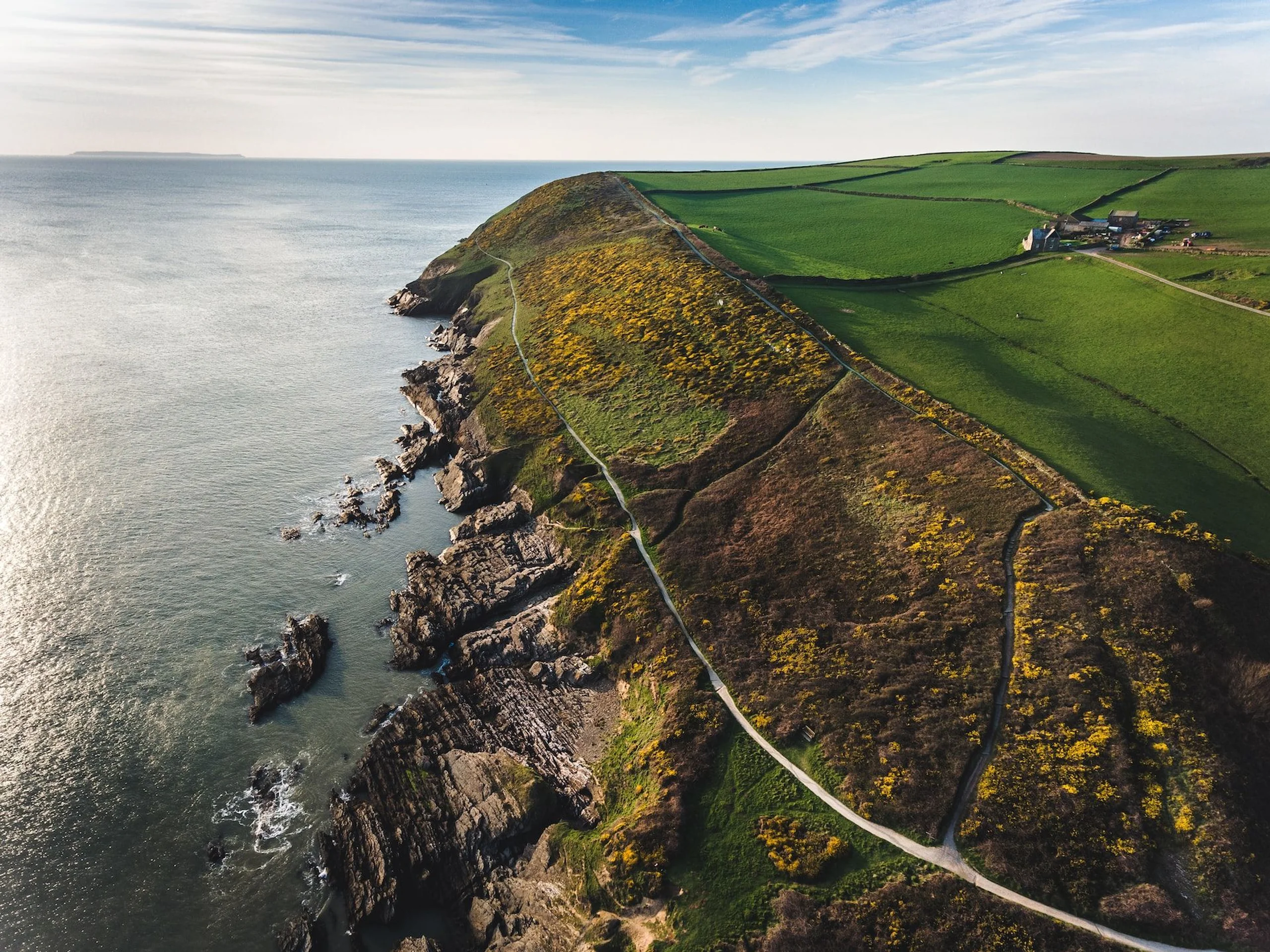 Hartland Cornwall Heritage Coast with green field overlooking ocean