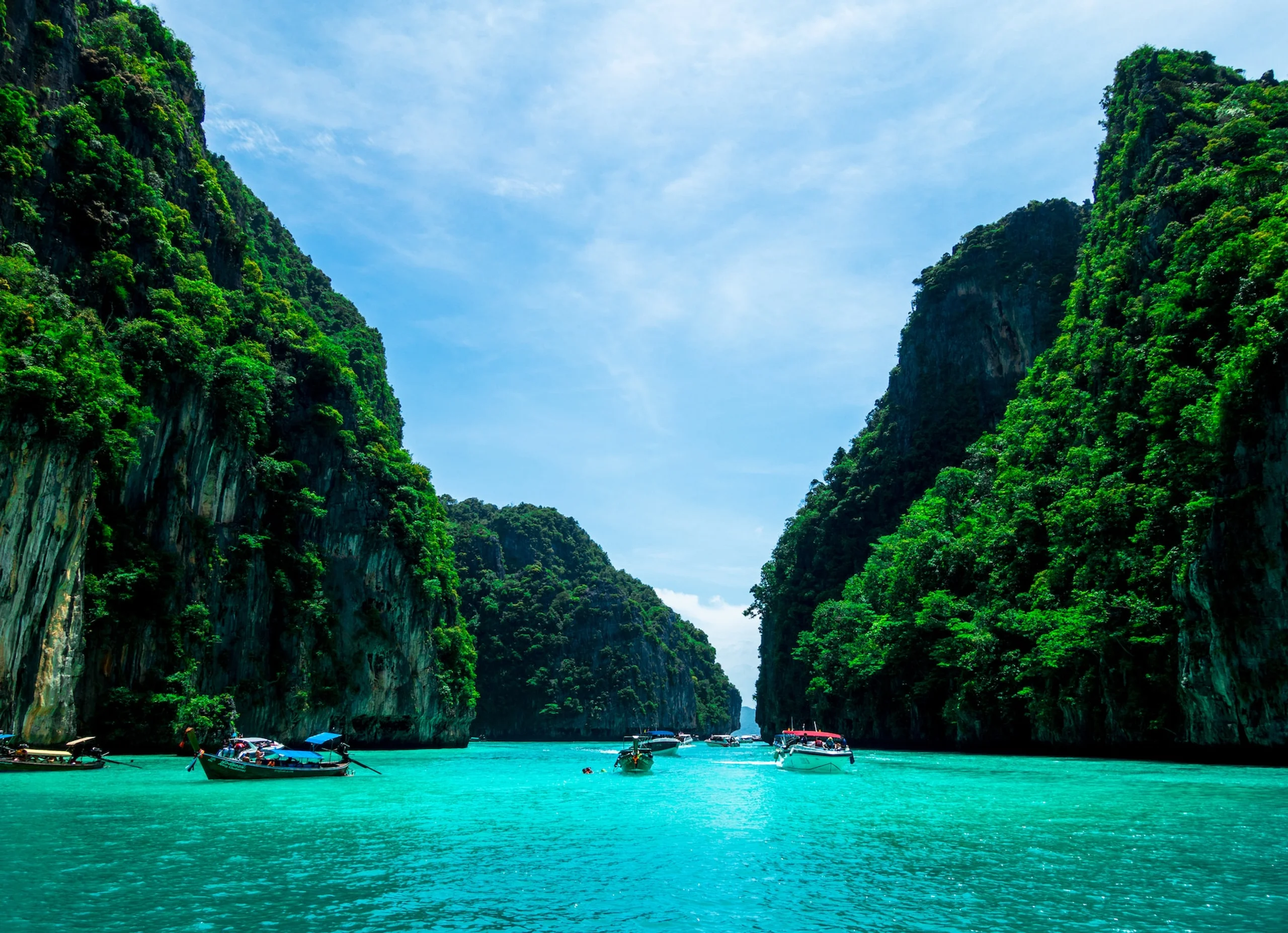 Cove of turquoise blue water and two lush mountains