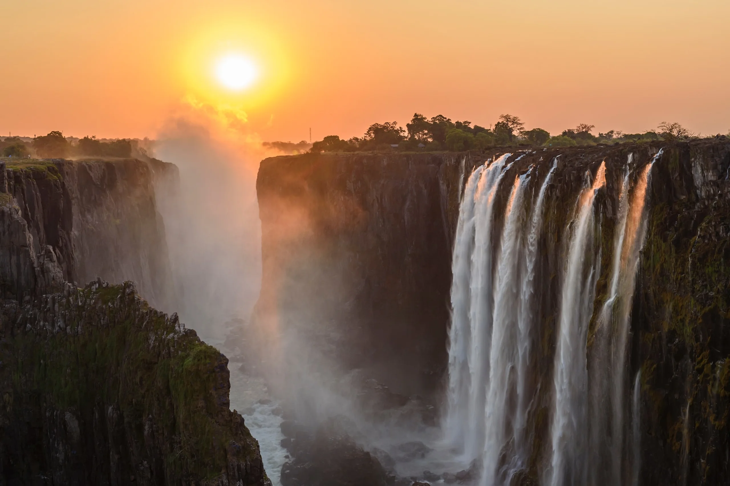 Sun setting over Victoria Falls